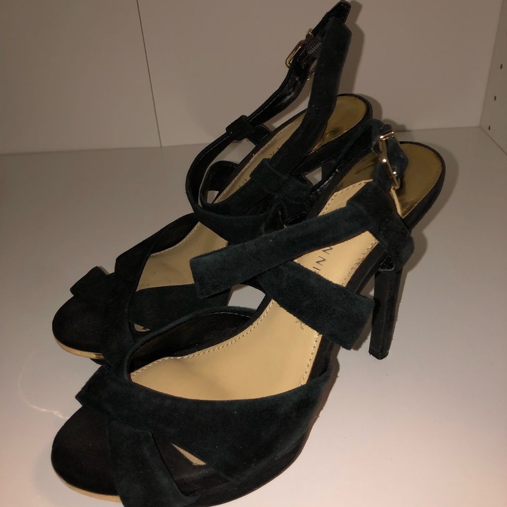 Black suede and gold open toe pumps